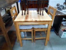 A pine kitchen table and 2 chairs 70cm x 70cm x height 74cm