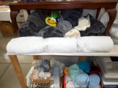 A quantity of mainly single throws, duvets (3) pillowcases (6) sheets (2), Tea towels (12),