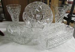 2 good quality heavy cut glass vases, a circular cut glass bowl and 2 other cut glass bowls.