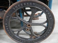 A cast iron wheel, W E Cook, London E C.
