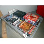 A quantity of CD's including Glen Miller & Country & quantity of DVD's including sports films etc.