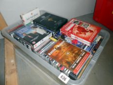 A quantity of CD's including Glen Miller & Country & quantity of DVD's including sports films etc.