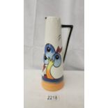 A Lorna Bailey Pottery Conical jug in Bursley Way Design, 23 cm tall, signed to base.