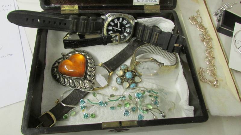 A faux suede box containing costume jewellery and watches. - Image 4 of 5