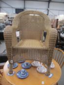 A Lloyd Loom style conservatory chair