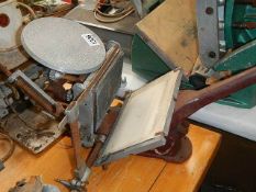 An old hand printing press.