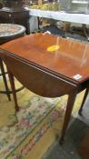 A mahogany inlaid drop side table.