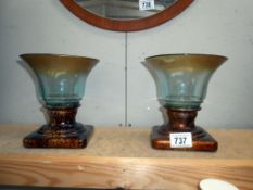 A pair of moulded art glass urn vases