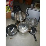 A mixed lot of stainless steel pans etc.