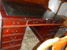 A mahogany double pedestal desk.