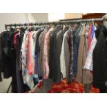 A rail of assorted clothing including coats, jackets, shirts etc., (some vintage).