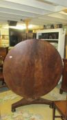 A large circular Victorian mahogany tip top table.