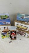 A collection of 8 boxed tinplate toys including boxers, soldier drummer, tram, bus etc.