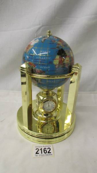 An Osborne & Allen Ltd., revolving globe incorporating a 4 way clock, needs battery. - Image 2 of 3