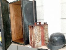 A pine trunk, vintage Valor can with brass cap and a 'Corker; motorcycle helmet.