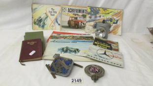 A quantity of Shell and other motoring books, 2 RAC badges, cycle lamp etc.