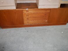 A low teak sideboard. ****Condition report**** 196cm x 43.5cm x height 59.