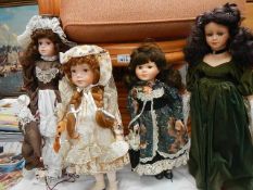 Four Leonardo porcelain collector's dolls.