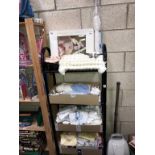 A quantity of new born clothes, parasol for pram/pushchair, shoes & cot mobile etc.