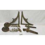 A pair of brass piano sconces, 2 brass beer taps and 2 brass shelf brackets.