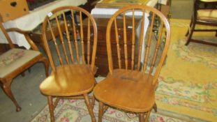 A pair of kitchen chairs.