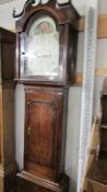 A mahogany cross banded 8 day moon dial Grandfather clock in working order,