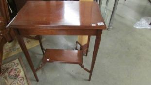 A mahogany inlaid occasional table.