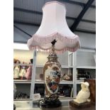 An oriental floral decorated urn table lamp