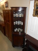 A modern astral glazed corner cupboard,