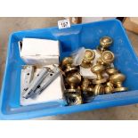 A box of brass knobs, hinges & catches etc.