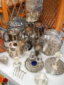 A mixed lot of silver plate including teapot, cruet, cake stand, place mats etc.