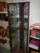 A good corner display cabinet with glass shelves.