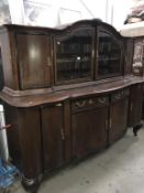 A large oak sideboard with cabinet top width 227cm, height 190cm,