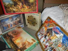 A mixed lot of jigsaw puzzles and games.