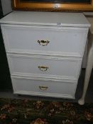 A three drawer melamine bedroom chest.