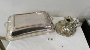 An early 20th century silver plate chamber candlestick together with a silver plate tureen.