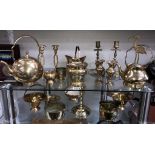 A mixed lot of brassware including candlesticks, bowls, teapot etc.
