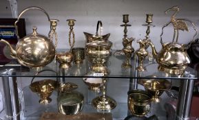 A mixed lot of brassware including candlesticks, bowls, teapot etc.