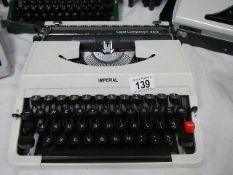 An Imperial Good Companion 203 portable typewriter in cream.