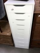A 9 drawer white melamine office filing chest Height 116cm, width 36cm,