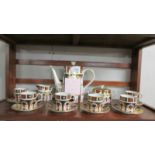 A Royal Crown Derby 15 piece coffee set (coffee pot a/f, handle cracked).