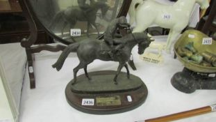 A resin model of a horse and jockey on base with plaque inscried Dunstall Park Winner 1995.
