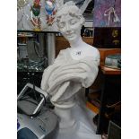 A plaster bust of a lady.