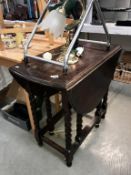 An oak gateleg table with barley twist legs.