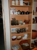 Six shelves of kitchen ware.