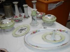 A mixed lot of china trinket set items including candlesticks.