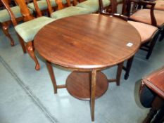 A mahogany round side table, height 66cm,