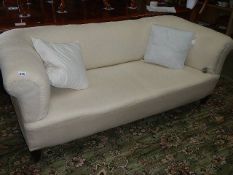 A calico covered Chesterfield sofa.