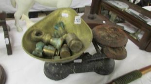 An set of old kitchen scales, quantity of weights etc.