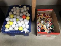 A box of over 200 golf balls and a box containing tees etc.